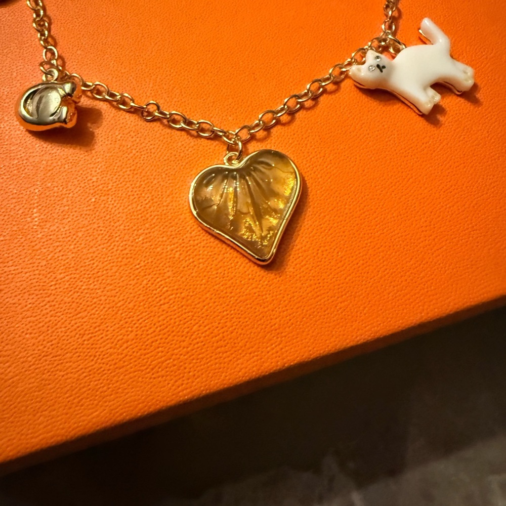 Coach Gold creature multi Charm Bracelet with Amber Heart & White Cat Charm - Picture 4 of 10